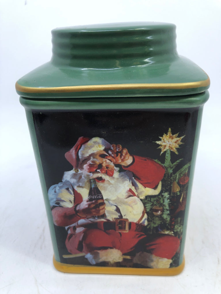 NIB GREEN SANTA STONEWARE CANISTER WITH LID.