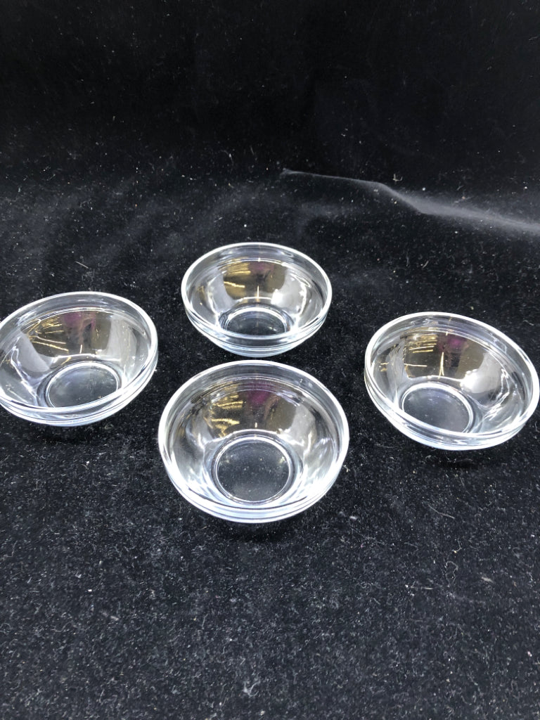 4 SMALL CLEAR SPICE JARS.