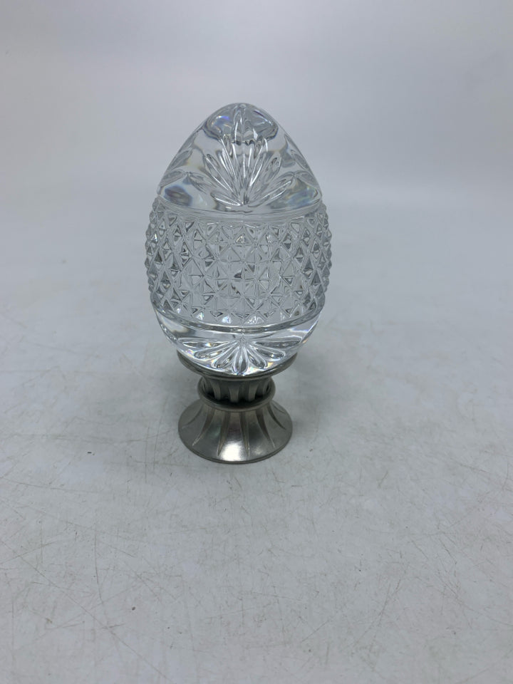 HEAVY GLASS TEXTURE EGG ON METAL STAND.