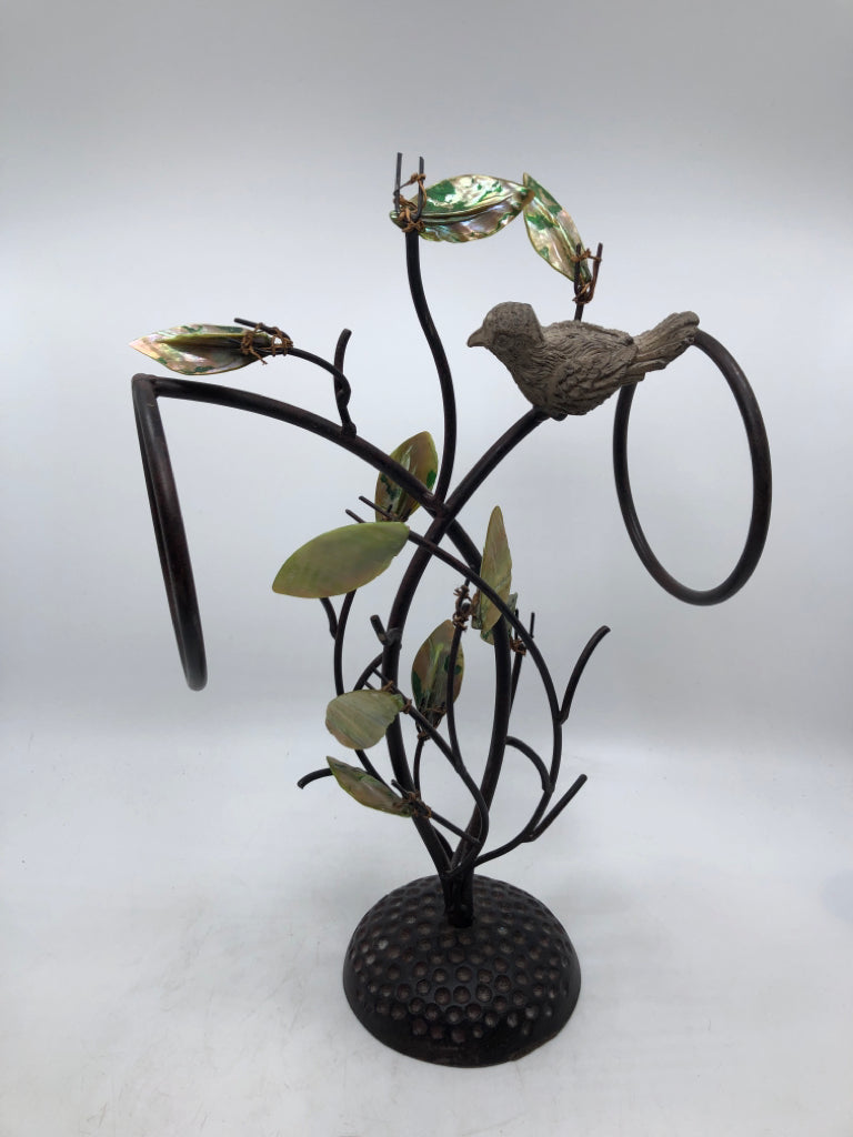 BROWN METAL W/LEAVES AND BIRDS TOWEL HOLDER.