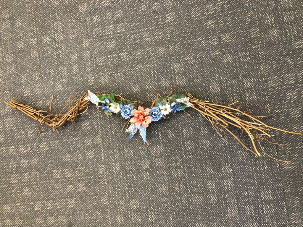 FAUX FLORAL AND TWIG SWAG.