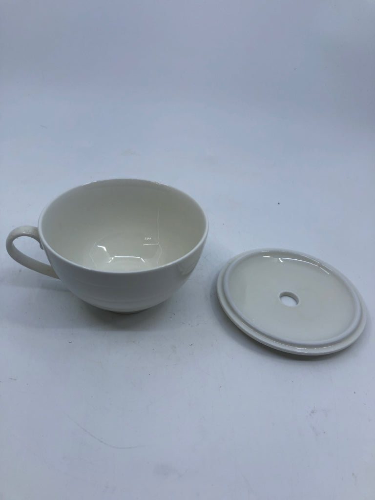 WHITE MUG W/ LID HOLE IN CENTER.