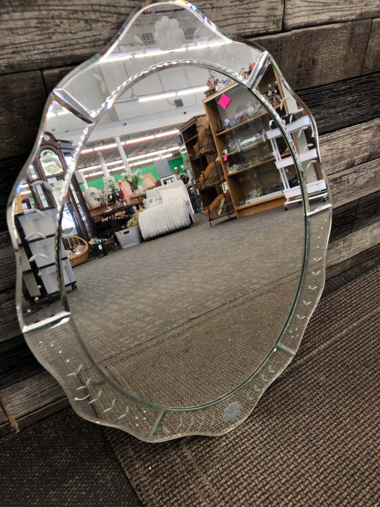 FLORAL ETCHED MIRROR W/CURVED EDGES.