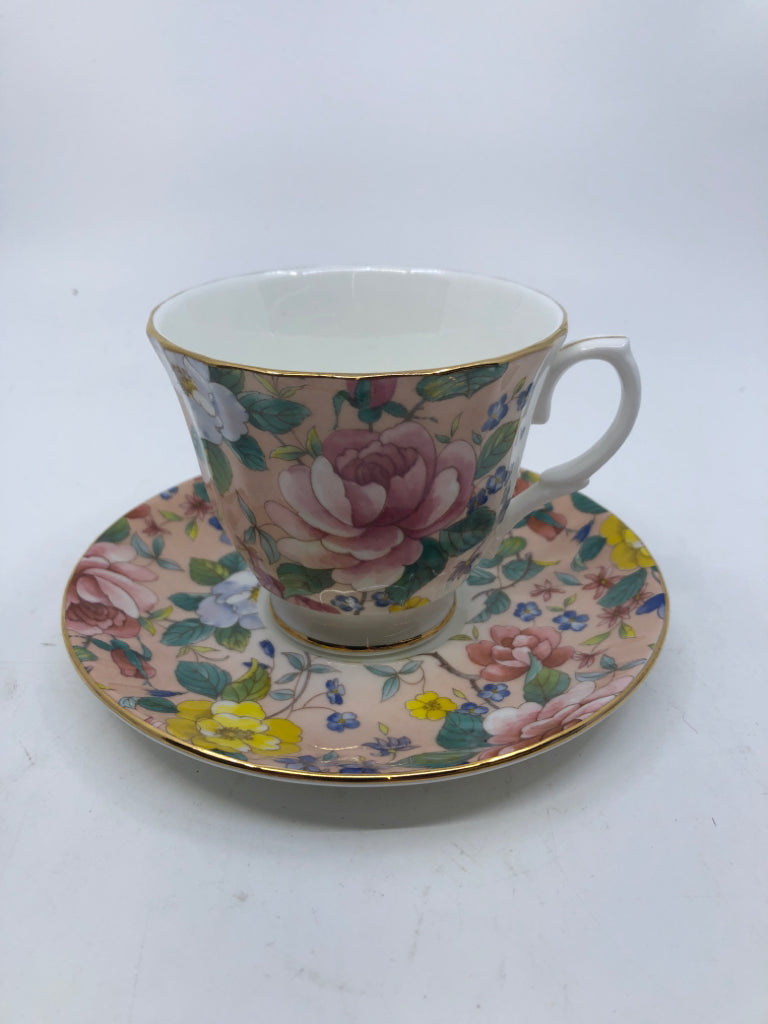 ROYAL KINGSTON PINK BASE W YELLOW FLORAL TEACUP AND SAUCER.