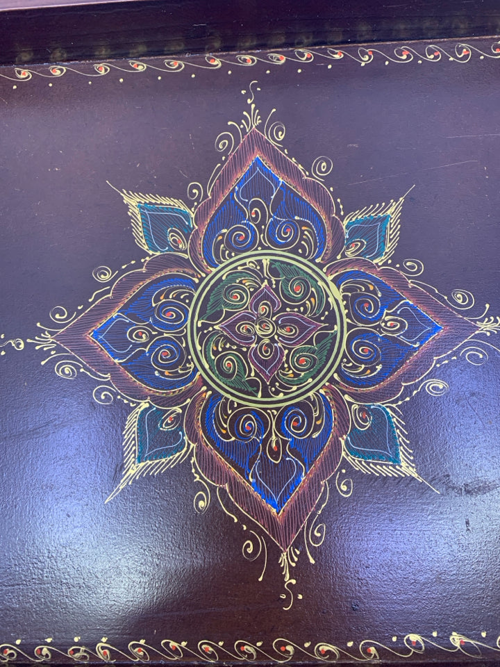 BROWN WOOD TRAY W/ COLORED MEDALLION IN CENTER W/ HANDLES.