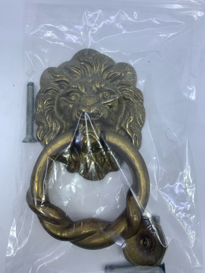 BRASS? LION DOOR KNOCKER W/ HARDWARE IN BAG.