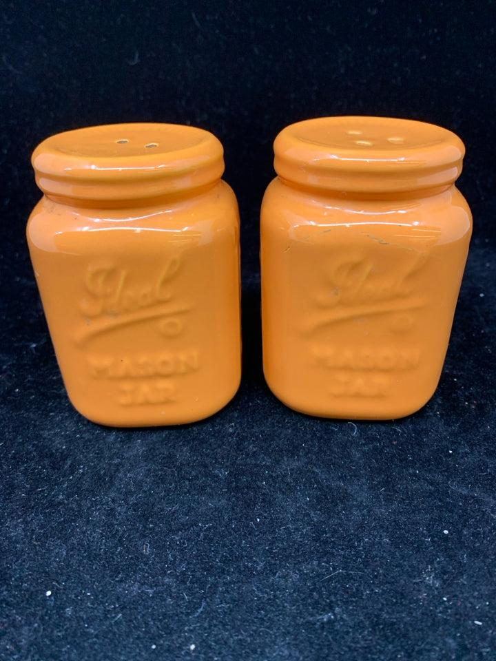 ORANGE SALT AND PEPPER MASON JAR STYLE SHAKERS.