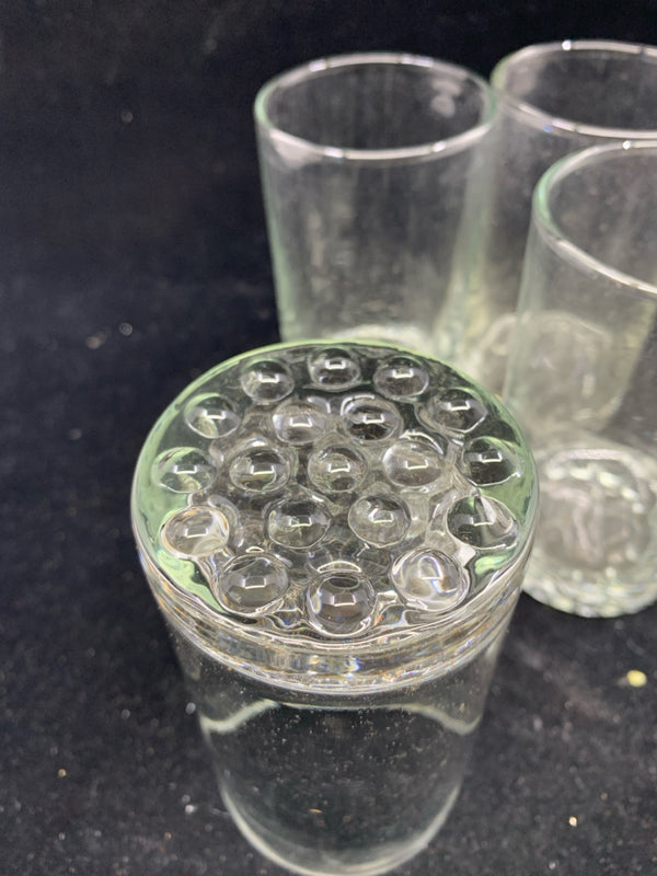 4 CLEAR GLASS JUICE GLASSES W/ BUBBLE PATTERN BOTTOM.