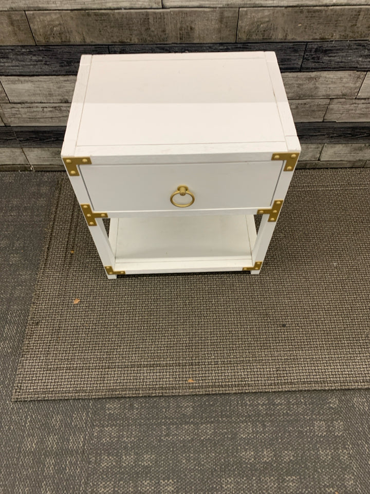 WHITE LOW TWO TIER SIDE TABLE W/ GOLD HARDWARE CIRCLE HANDLES.