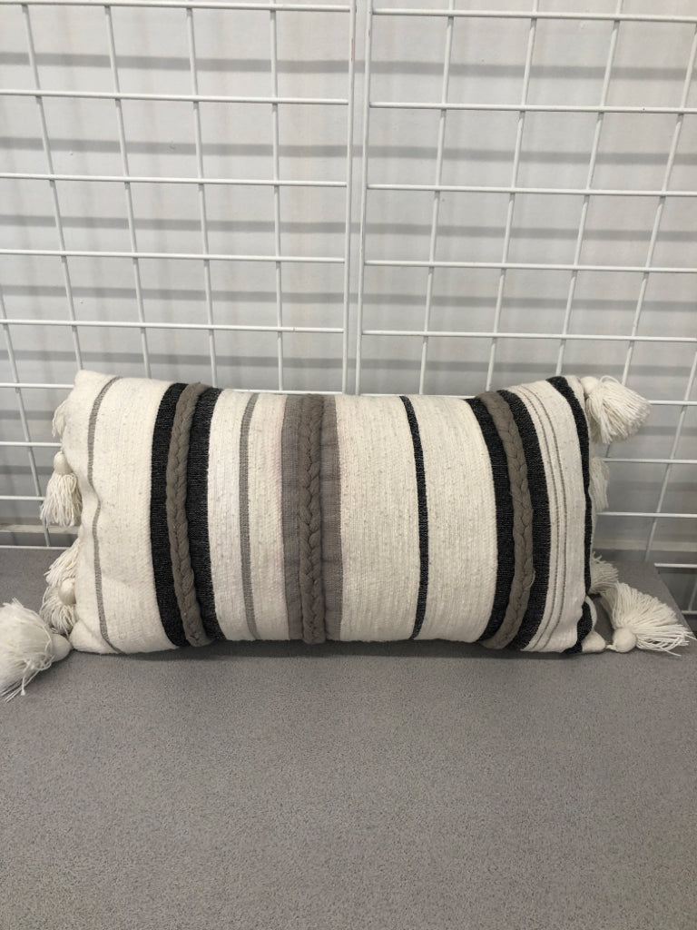 GREY STRIPE PILLOW W/TASSLES AND BRAID DETAIL.