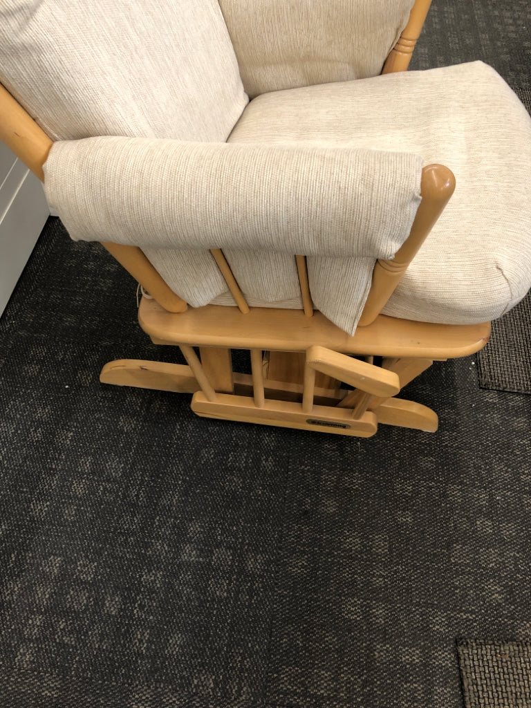 BLONDE WOODEN ROCKING CHAIR W/LEVER TO LOCK & BEIGE CUSHION.