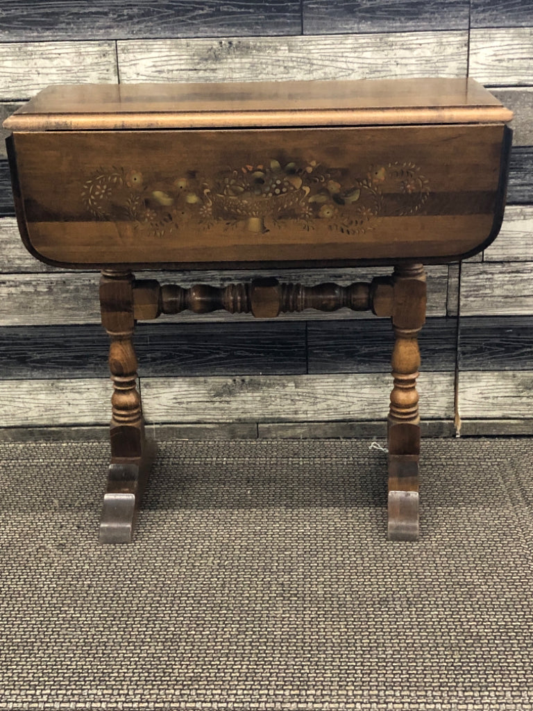 VTG DARK WOOD DROP LEAF SIDE TABLE W/ PAINTED BASKET OF FRUIT.