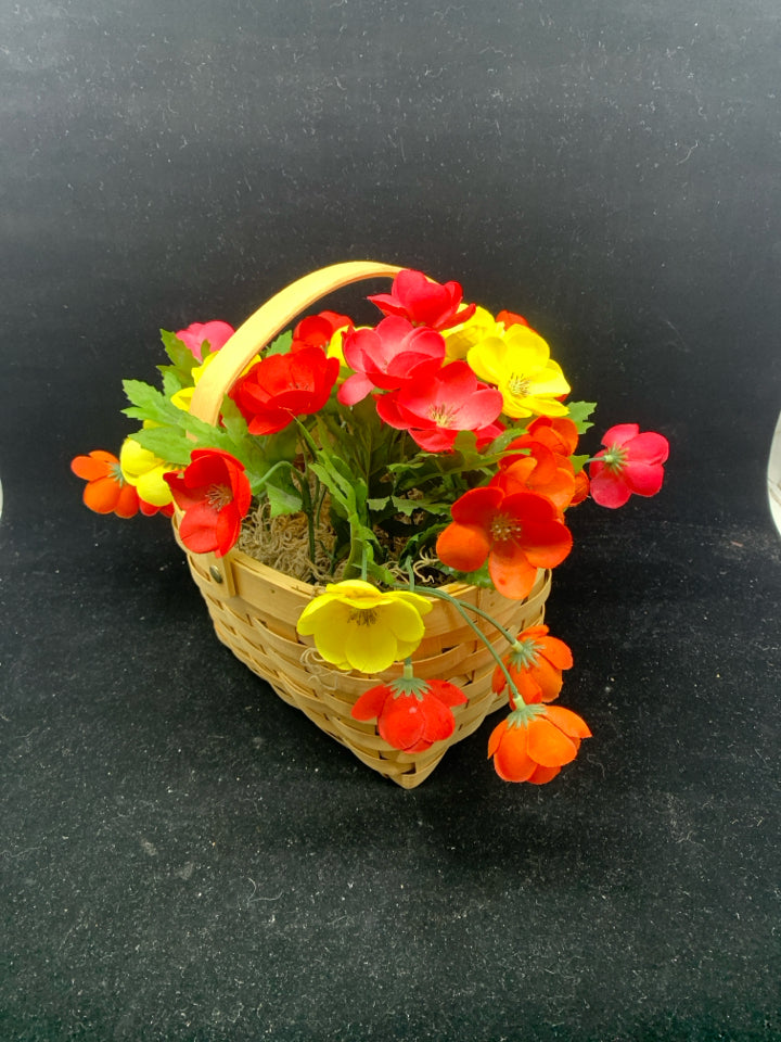 FAUX YELLOW AND PINK FLOWERS IN BASKET.