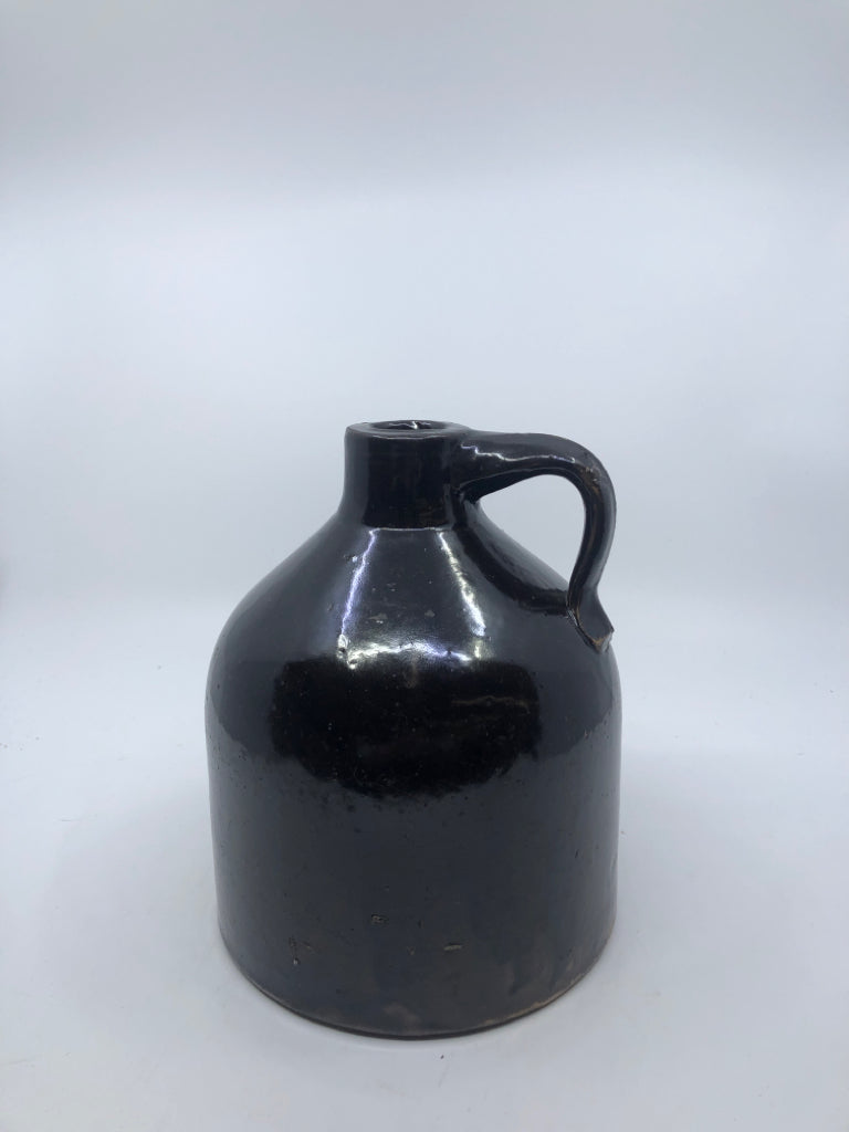 DARK BROWN POTTERY JUG.