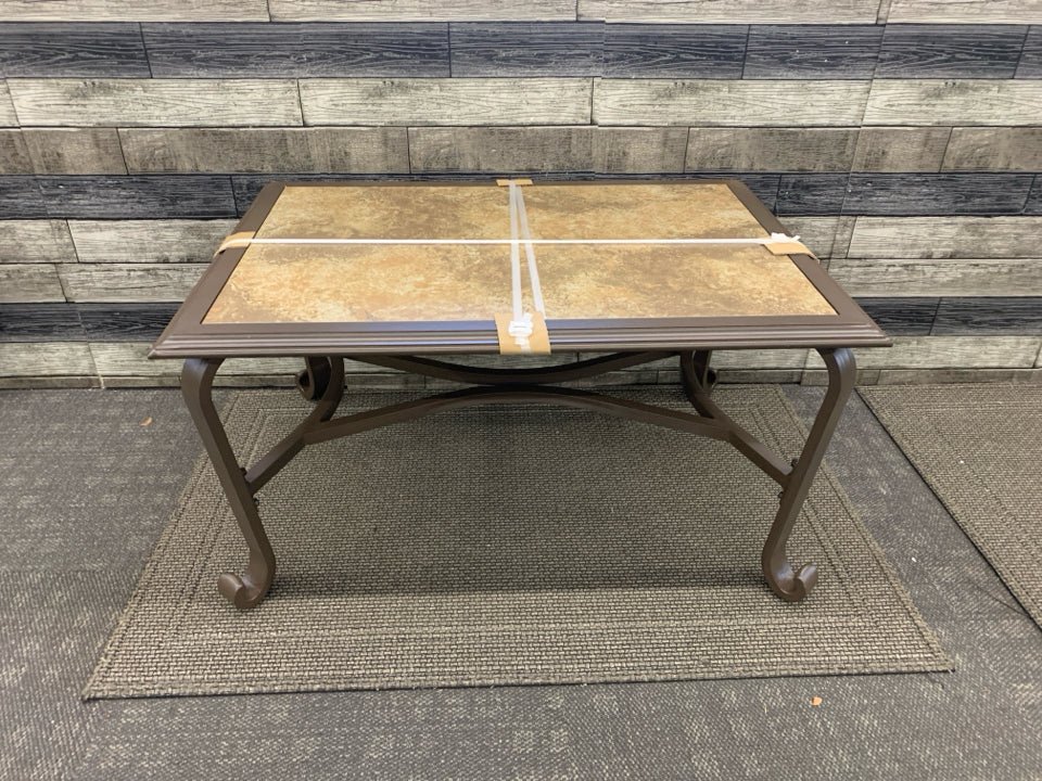 NEW BROWN METAL PATIO TABLE W STONE TOP.