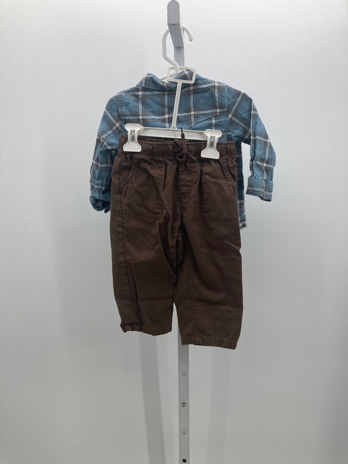PLAID SHIRT AND BROWN PANTS