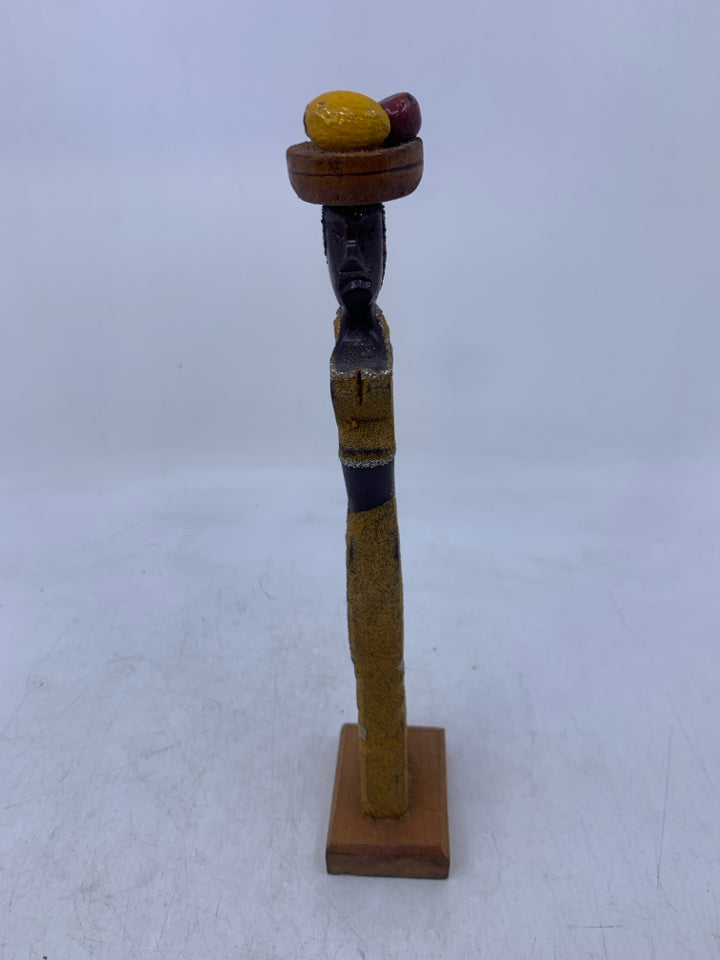 CARVED WOMAN CARRYING FRUIT ON HEAD.