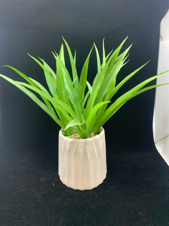 FAUX SUCCULENT IN WHITE POT.
