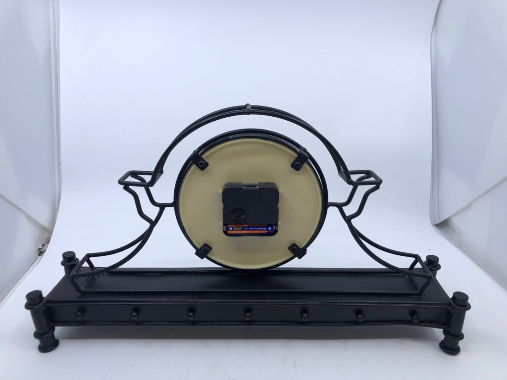 METAL SHELF CLOCK, PLAID BACKGROUND.