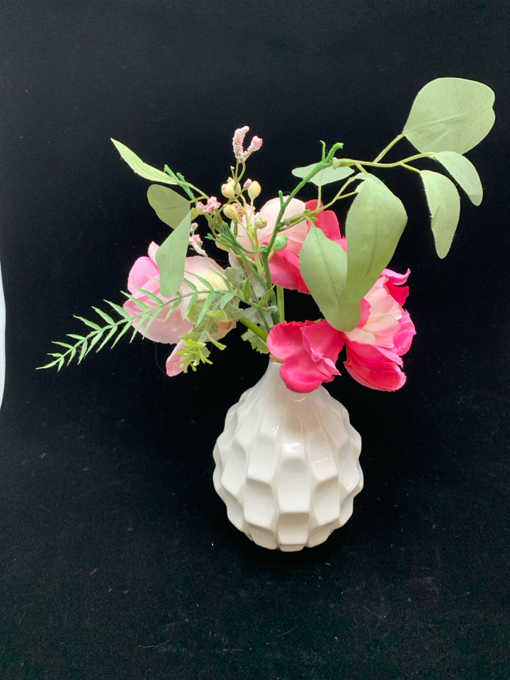 FAUX PINK FLORALS IN WHITE ROUND CERAMIC VASE.