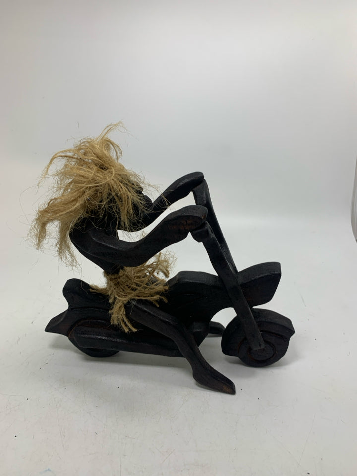 WOOD CARVED FOLK ART MAN ON MOTORCYCLE.