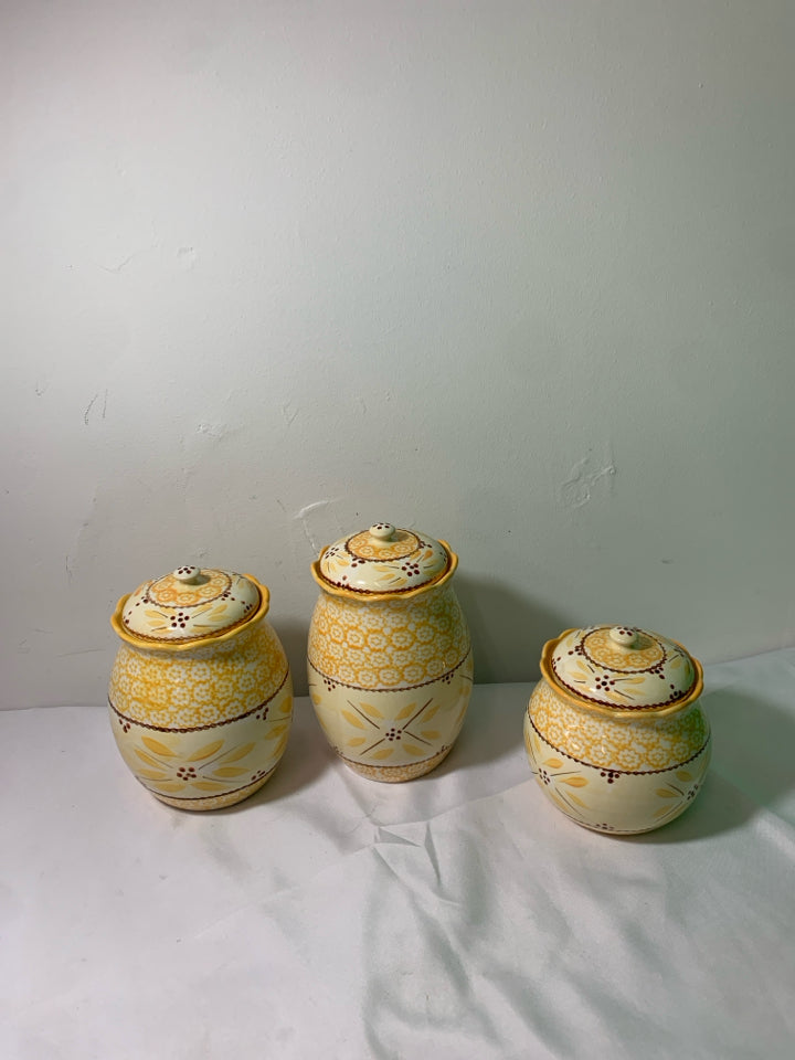 3 YELLOW PATTERN TEMPTATIONS CANISTERS.