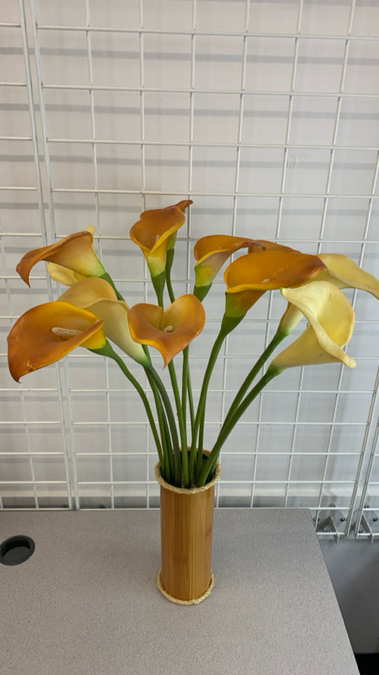 FAUX LILIES IN METAL FAUX WOOD VASE.