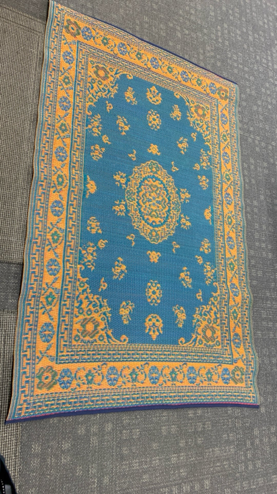BLUE/ORANGE MAD MATS REVERSIBLE INDOOR OUTDOOR RUG.