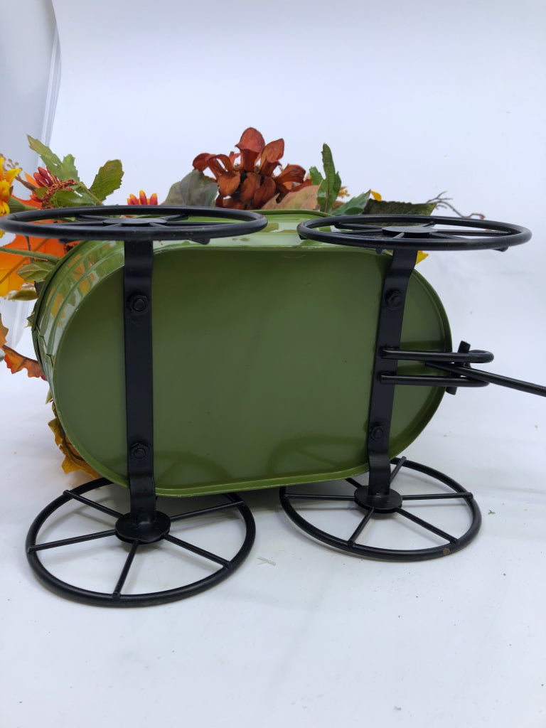 FAUX FALL BOUQUET IN GREEN METAL WAGON.