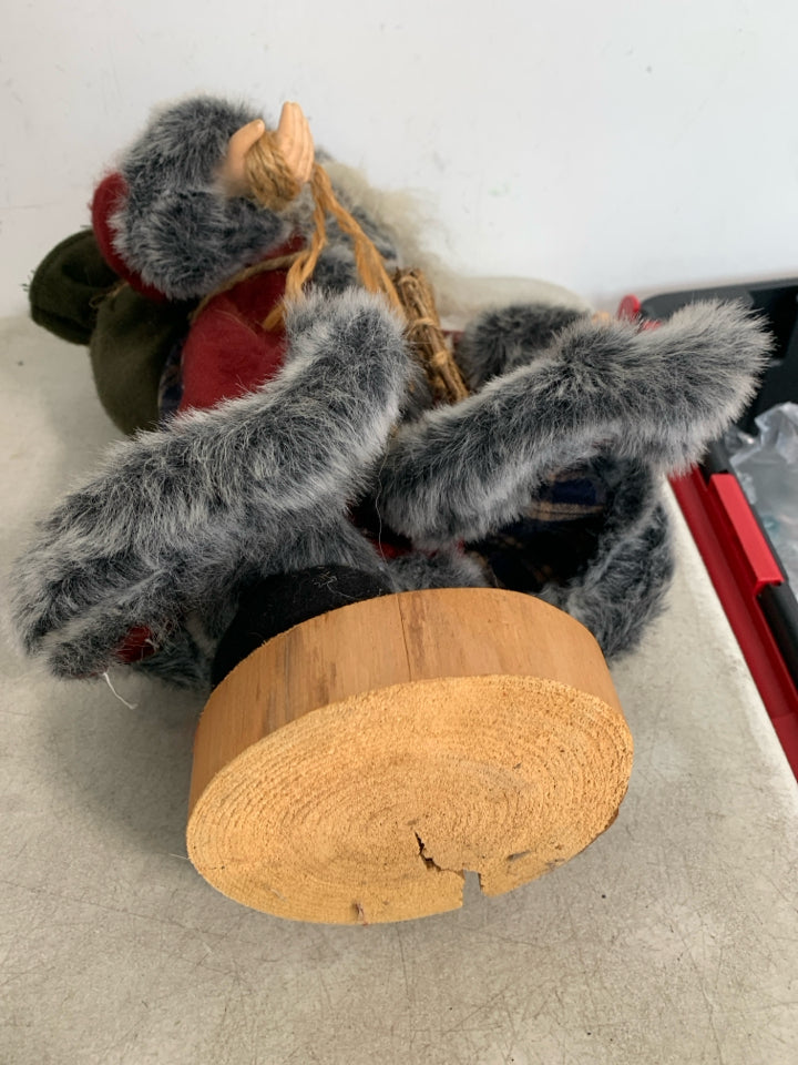 MAROON/FUR COAT STANDING SANTA W/ SNOWSHOES.