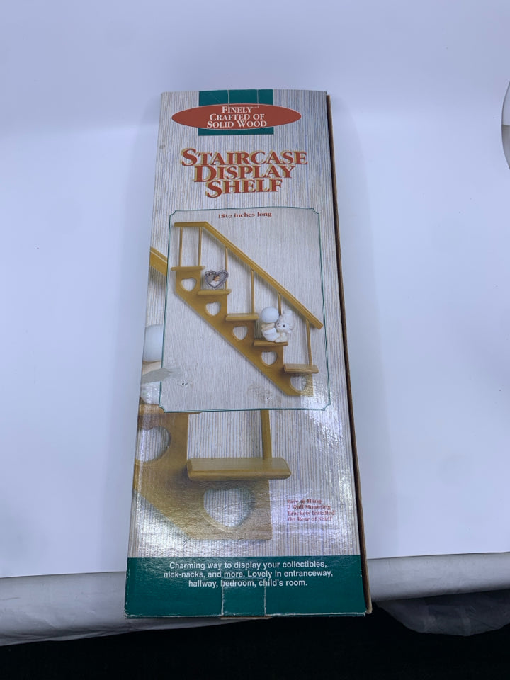 NIB STAIRCASE DISPLAY SHELF.