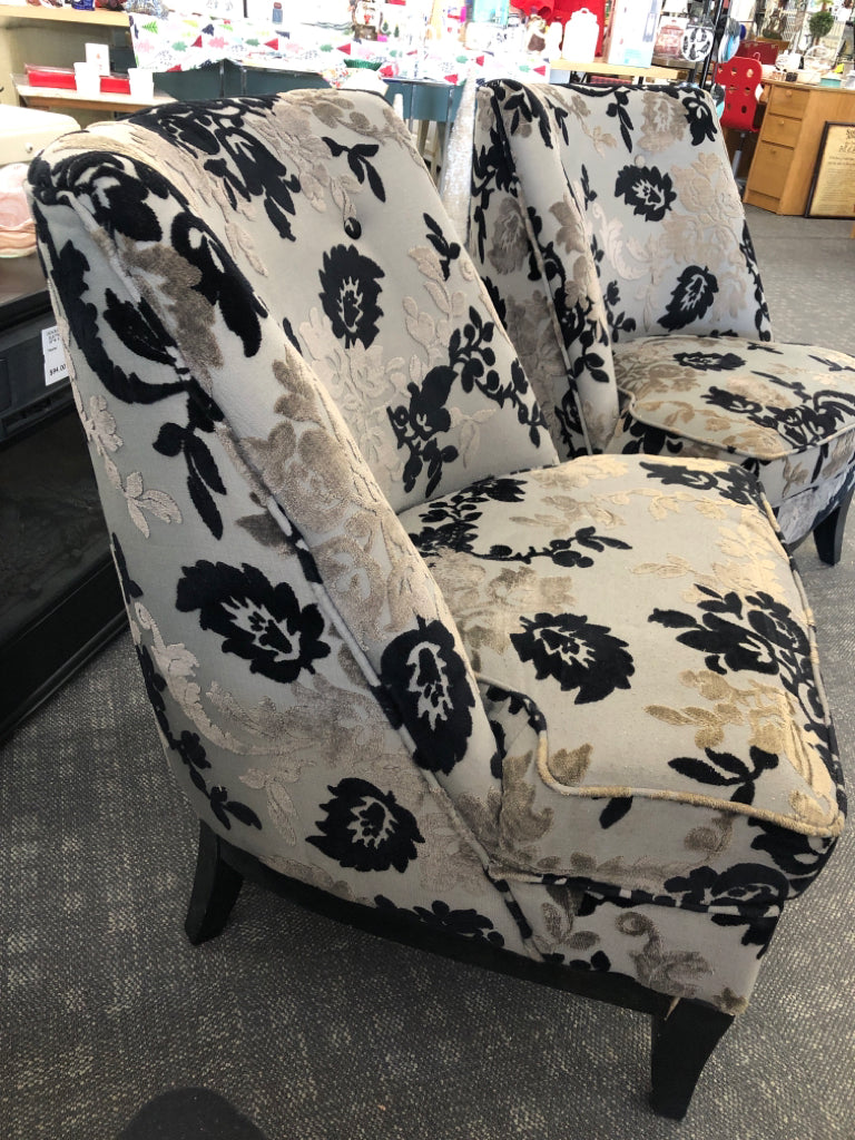 BLACK FLORAL UPHOLSTERED CHAIR W/ WOOD LEGS.