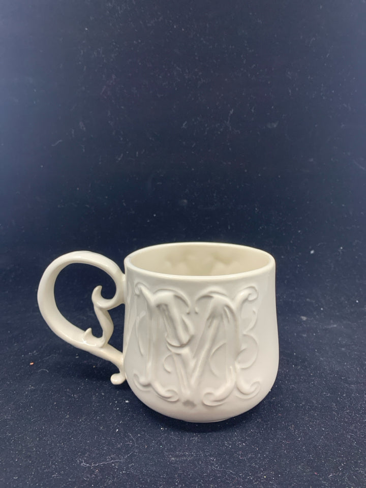 CREAM W/ FANCY HANDLE "M" MUG.