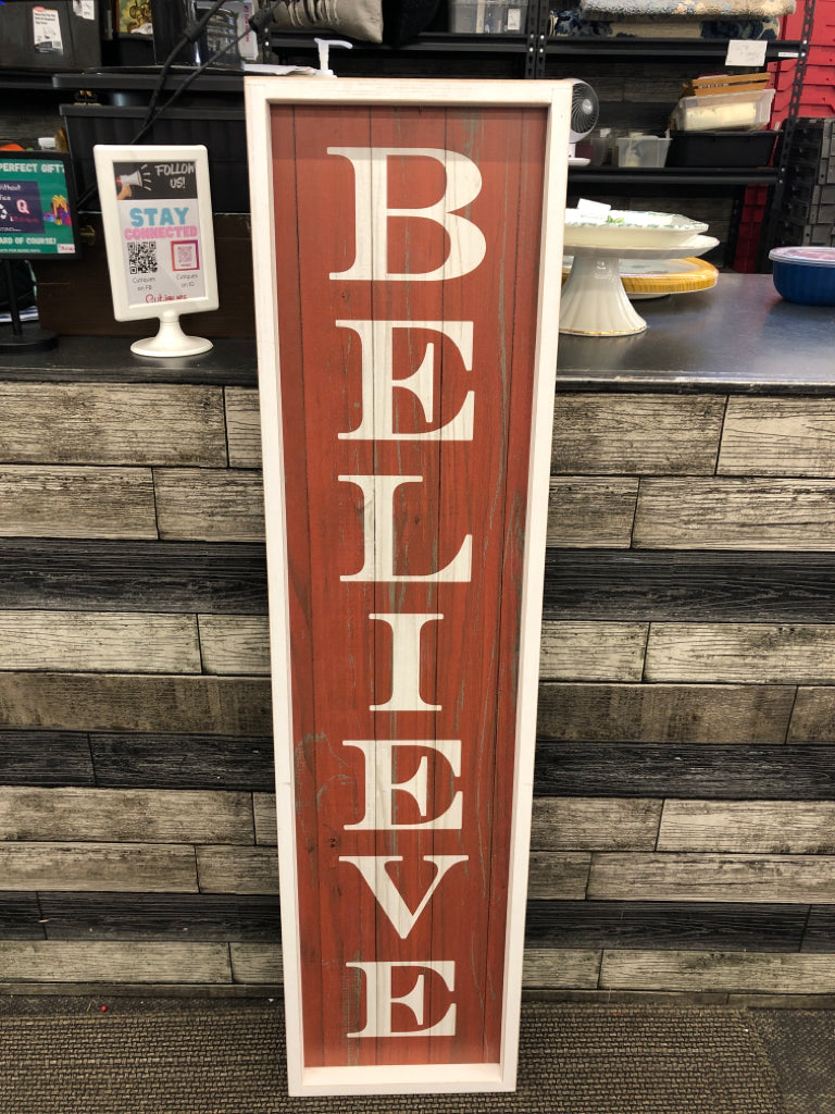 RED "BELIEVE" WALL HANGING.