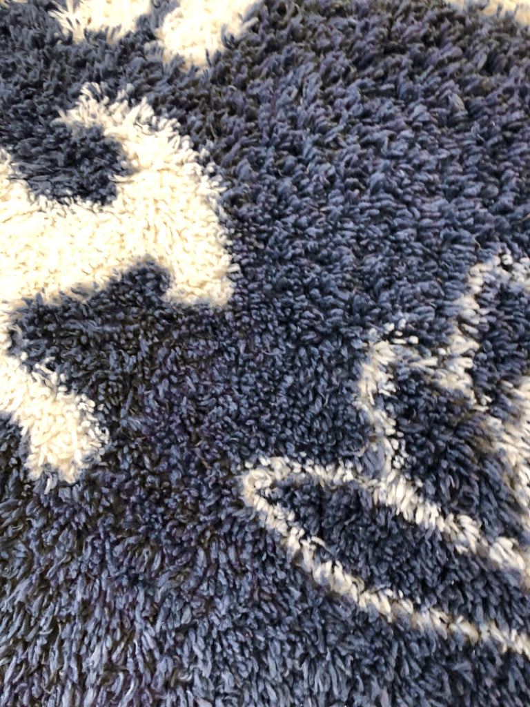 BLUE DINOSAUR WASHABLE RUG.