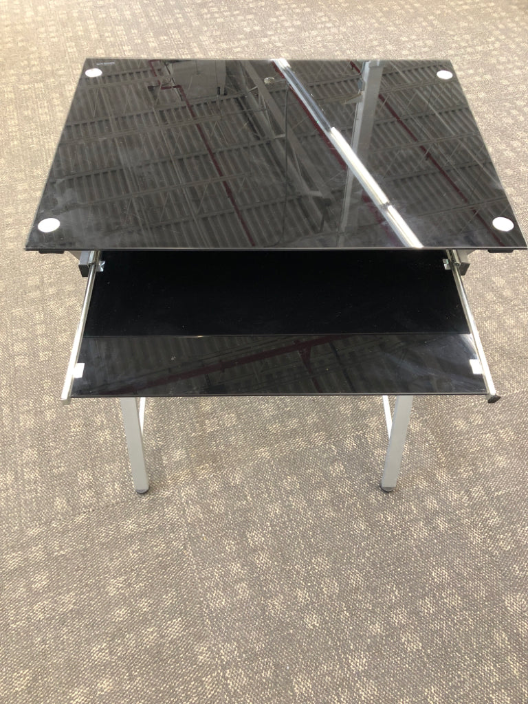 GLASS STUDENT DESK W/WHITE ROLLING CHAIR AND LAP SHELF.