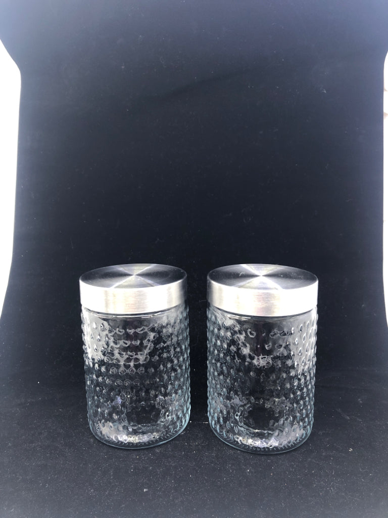 2 GLASS CANISTERS W/ EMBOSSED DOTS + METAL LIDS.