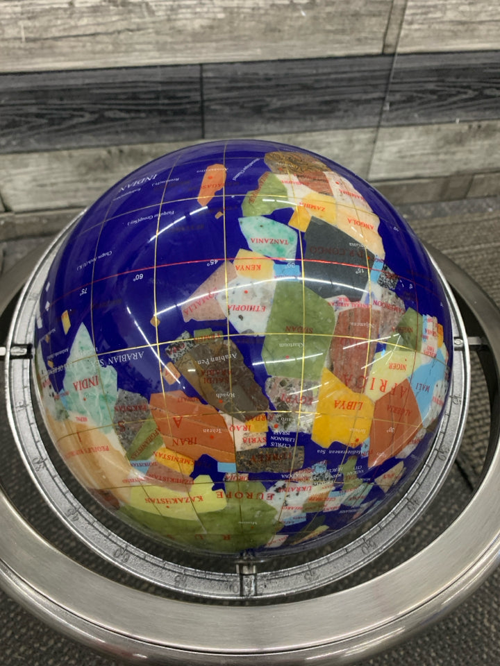 GLOBE WITH DIFFERENT STONE COUNTRIES.