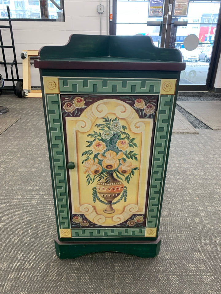 SMALL CORNER CABINET DARK GREEN/MAROON W/ VASE YELLOW ROSES.