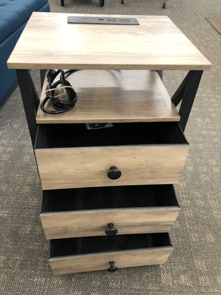 PALE WOOD SIDE TABLE W/3 DRAWERS, PLUG, AND LED LIGHT W/REMOTE.