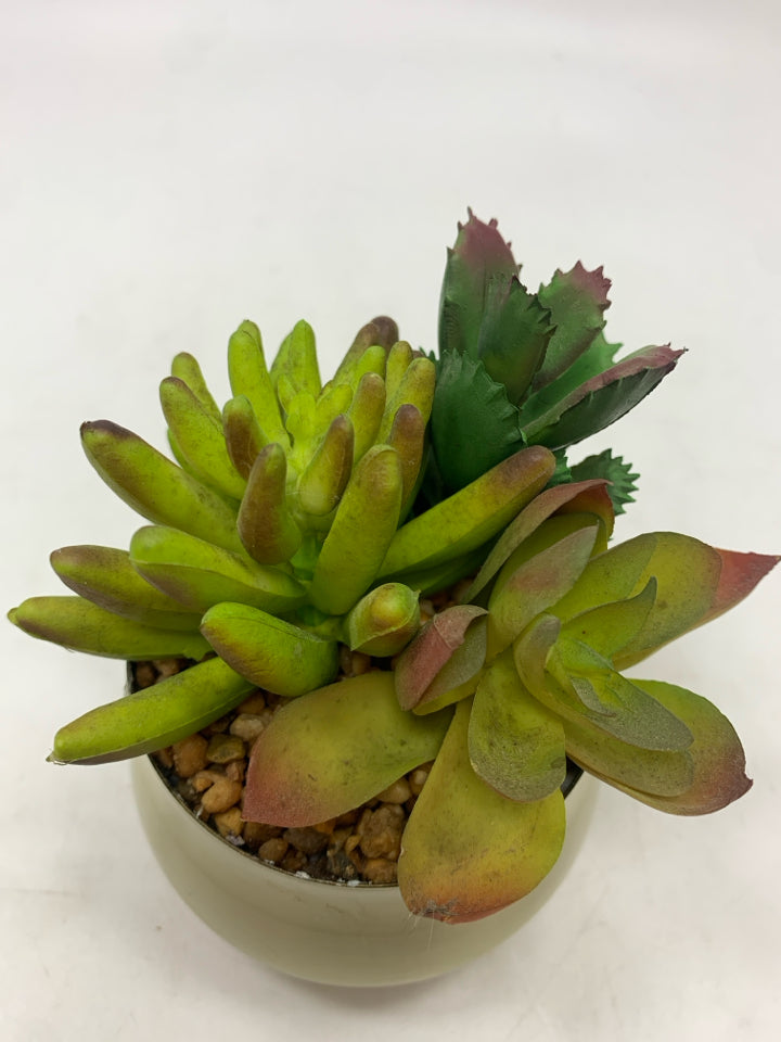 FAUX SUCCULENT IN GOLD POT.