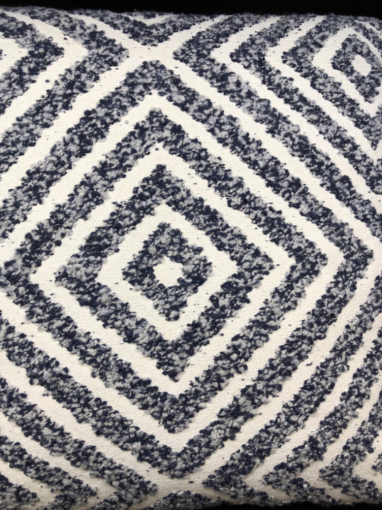 CREAM PILLOW W/BLUE TEXTURED DIAMOND DESIGN.