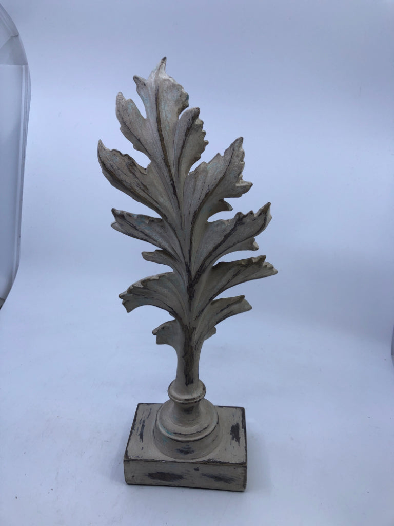 DISTRESSED TAN RESIN LEAF ON STAND.