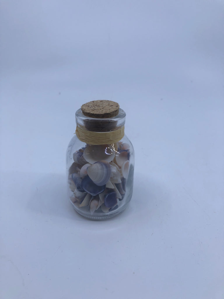 SMALL BOTTLE W SHELLS.