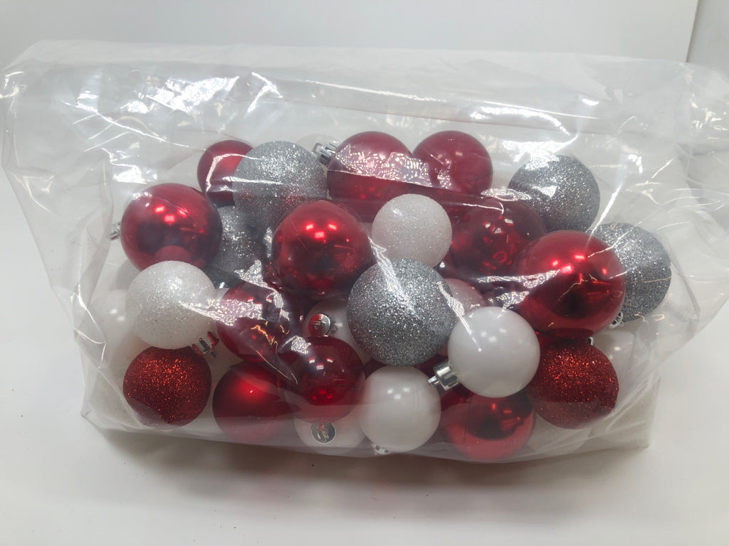 BAG OF RED/WHITE/SILVER GLITTER PLASTIC ORNAMENTS.