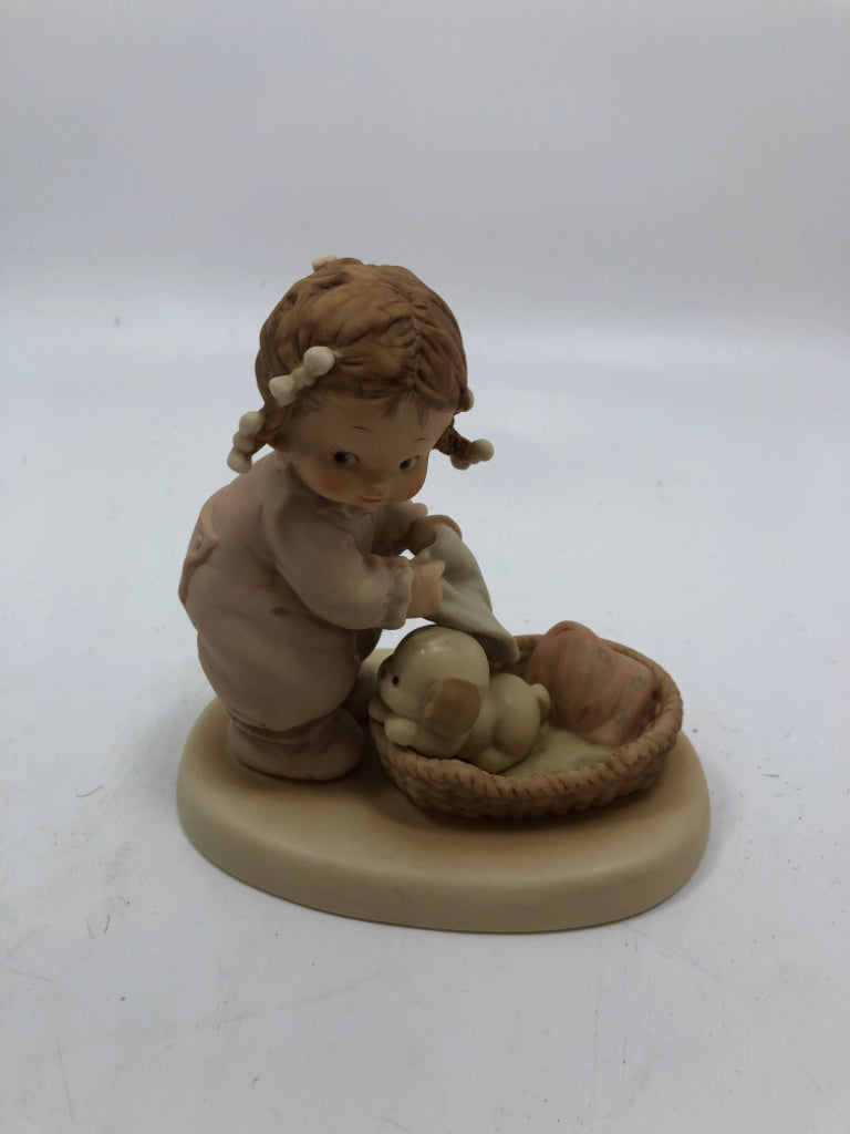 GIRL TUCKING DOG IN BED FIGURE.
