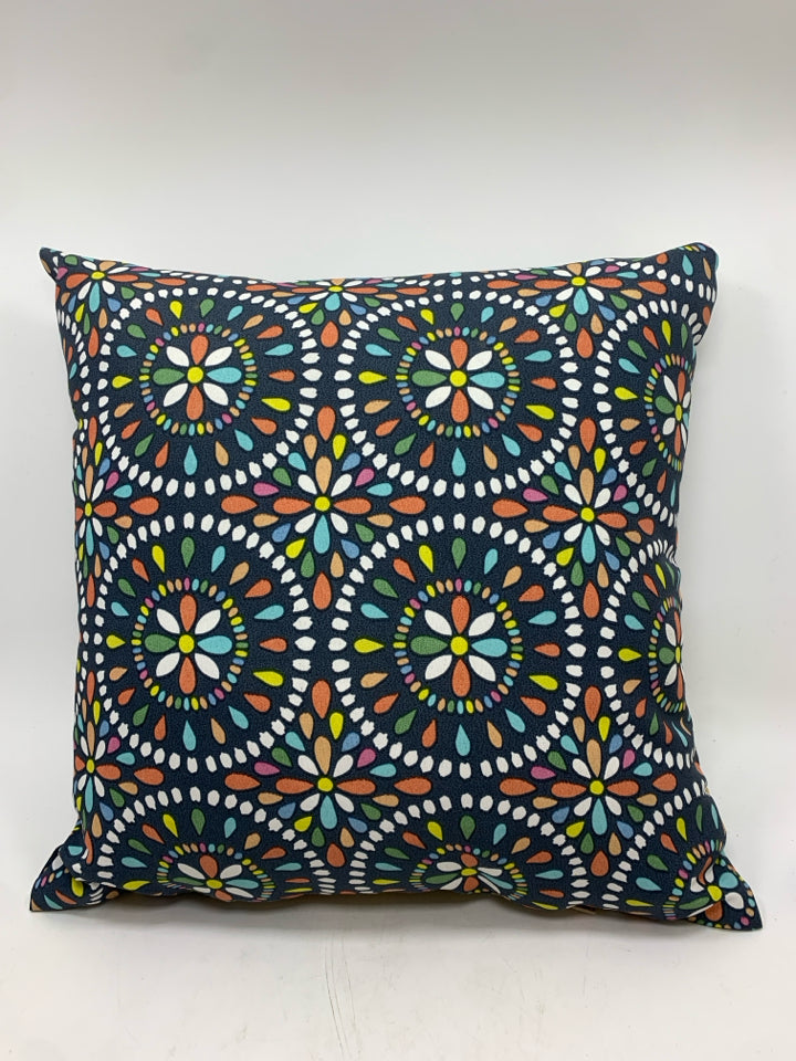 BLUE PILLOW W/RAINBOW MANDALA PATTERN.