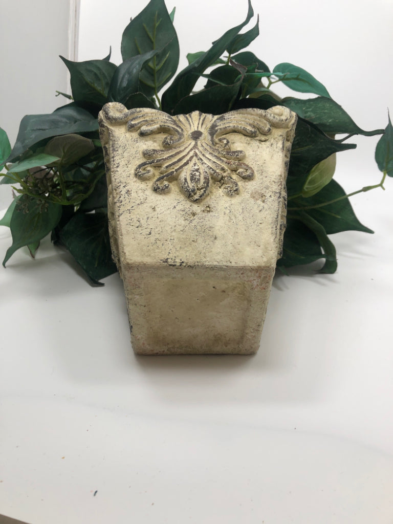 GREENERY IN FAUX STONE POT.