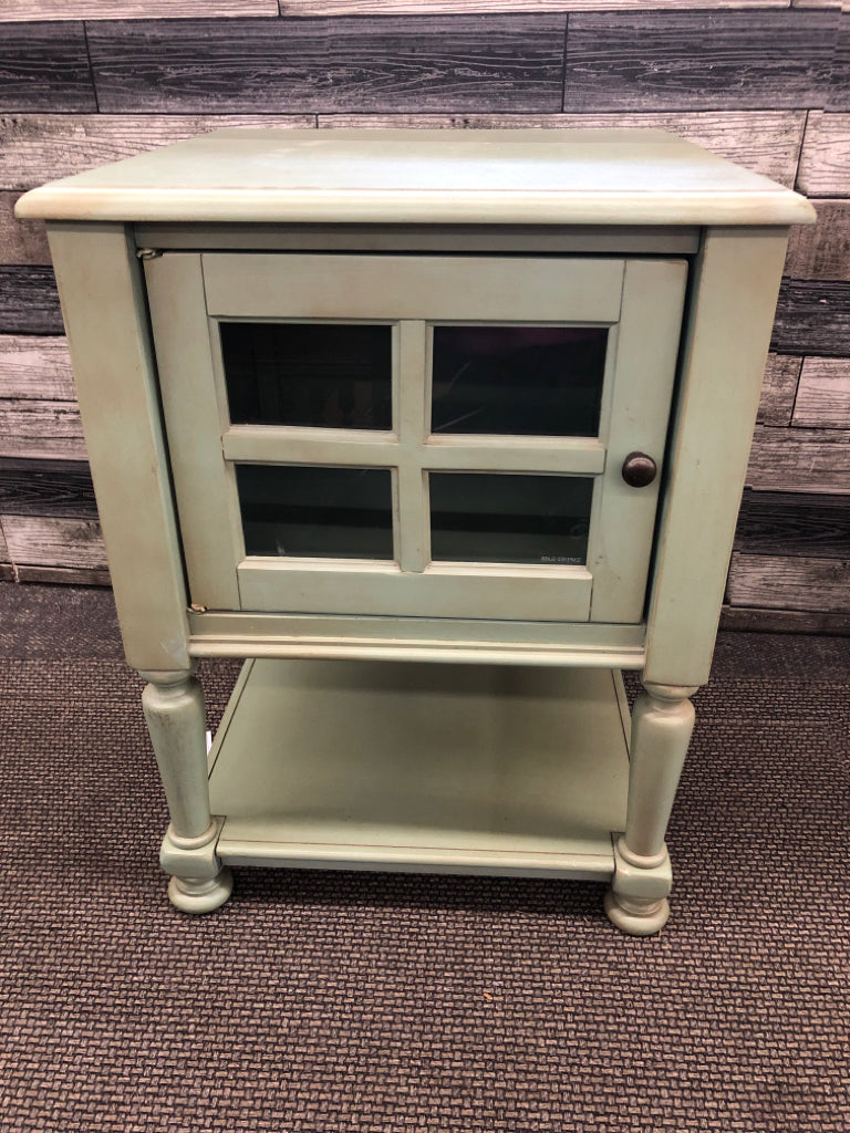 SMALL GREEN END TABLE W CABINET AND BOTTOM SHELF.