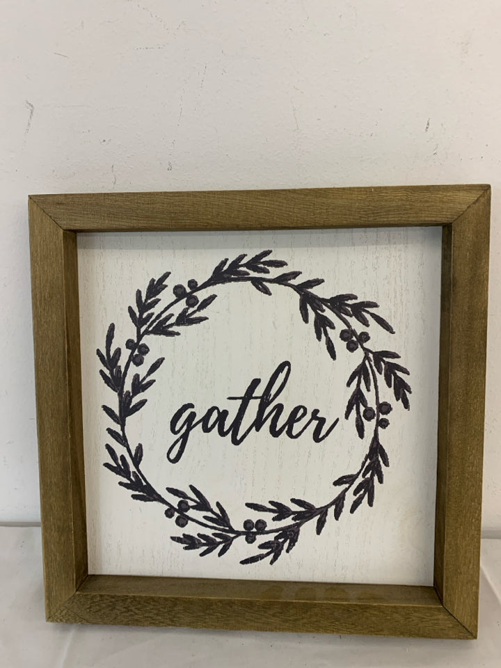 GATHER WALL HANGING IN WOOD FRAME.